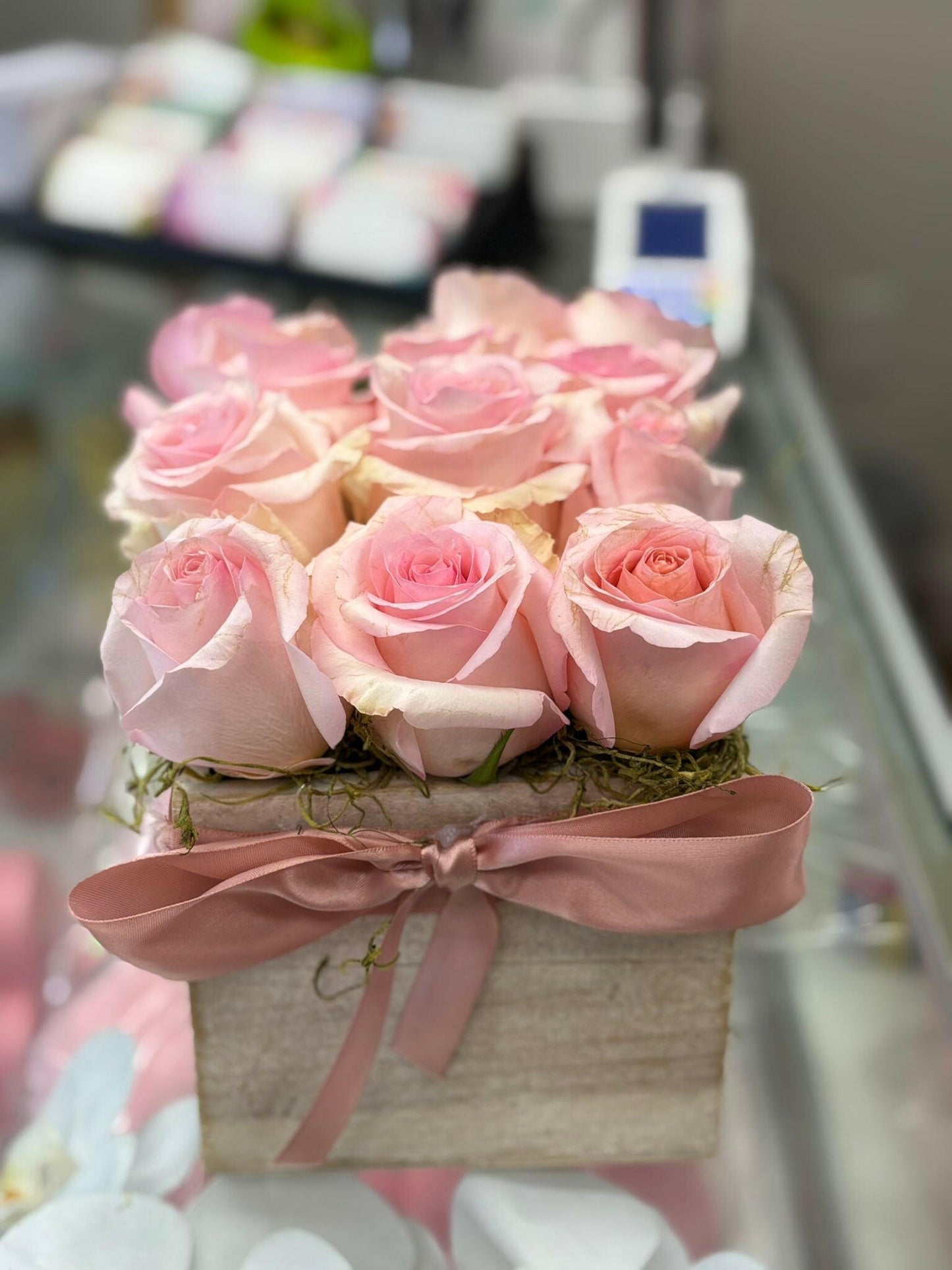 Flower arrangement of pink roses in a square wooden box - Flower Shop in Hollywood