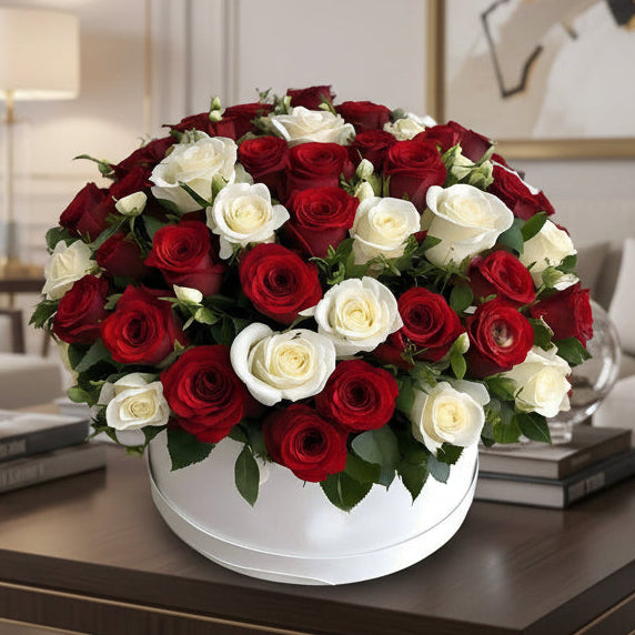 Red and White Roses Arrangement in a white hat box located at the living room table.