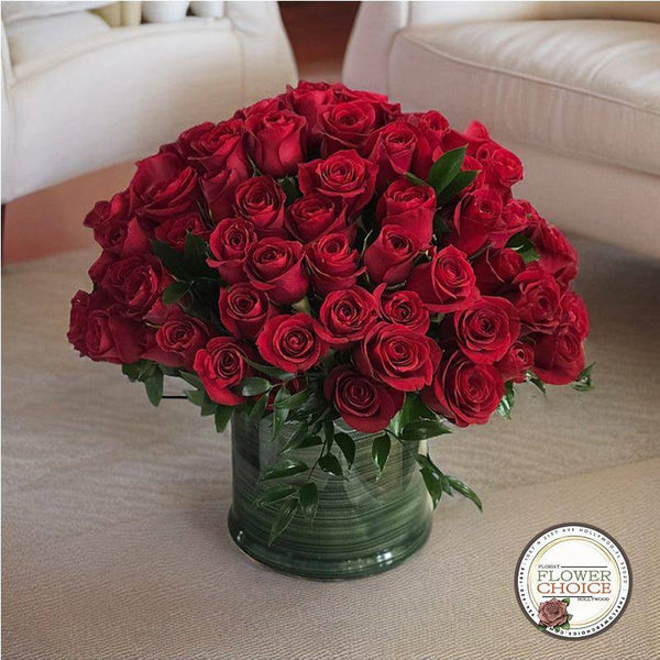 100 Medium Red Roses in a Vase, a medium side clear vase.