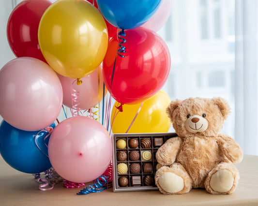 Add a Gift to Your Order - showing three gift add-ons together — chocolates, colorful balloons, and a soft plush teddy bear.