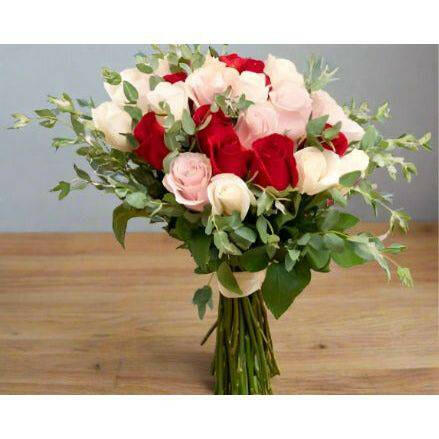 Roses Wrapped Bouquet with pink red and white roses with fillers and greens.