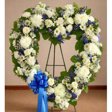 Blue & White Heart Sympathy heart shape design with white flowers with a blue ribbon.