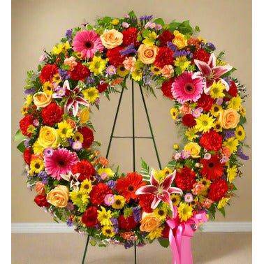 Funeral Standing Wreath red and yellow flowers with greens and fillers 