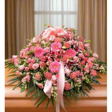 Pink Half Casket Cover filled with pink roses, lilies, daisies, and more.- Flower Shop in Hollywood