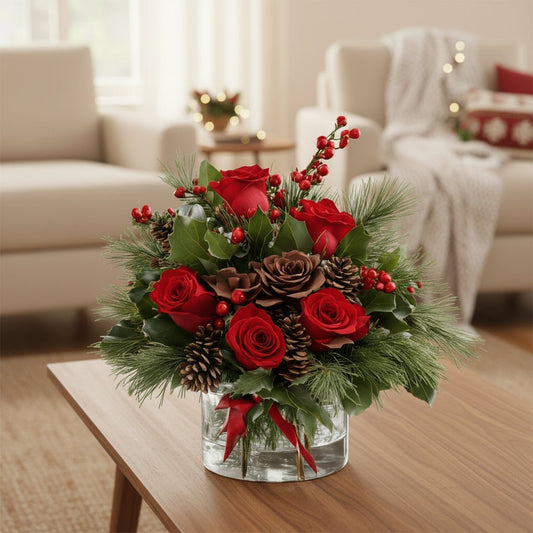 Holiday Red Roses Arrangement set on a wooden table located at the Livingroom.