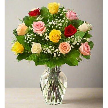 Bouquet of multicolored roses in a glass vase