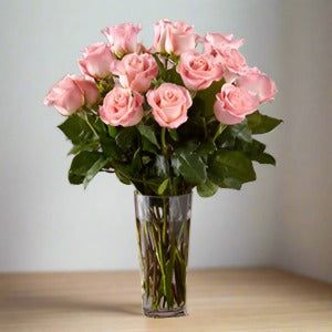 Bouquet of pink roses in a clear glass vase