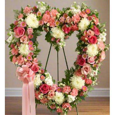 Pink Floral Standing Heart, different pinks on roses and mixed flowers on an open standing heart arrangement.