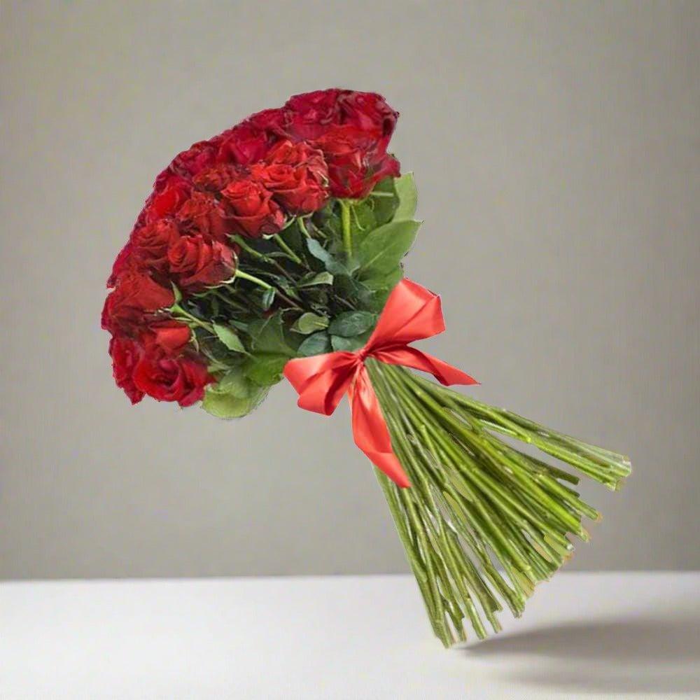 Bouquet of red roses tied with an orange ribbon