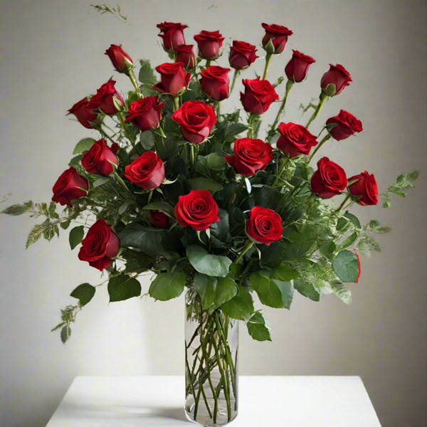 A bouquet of red roses in a glass vase.