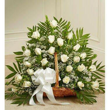 White Rose Sympathies Basket arrangement in a fire side basket with fillers and greens